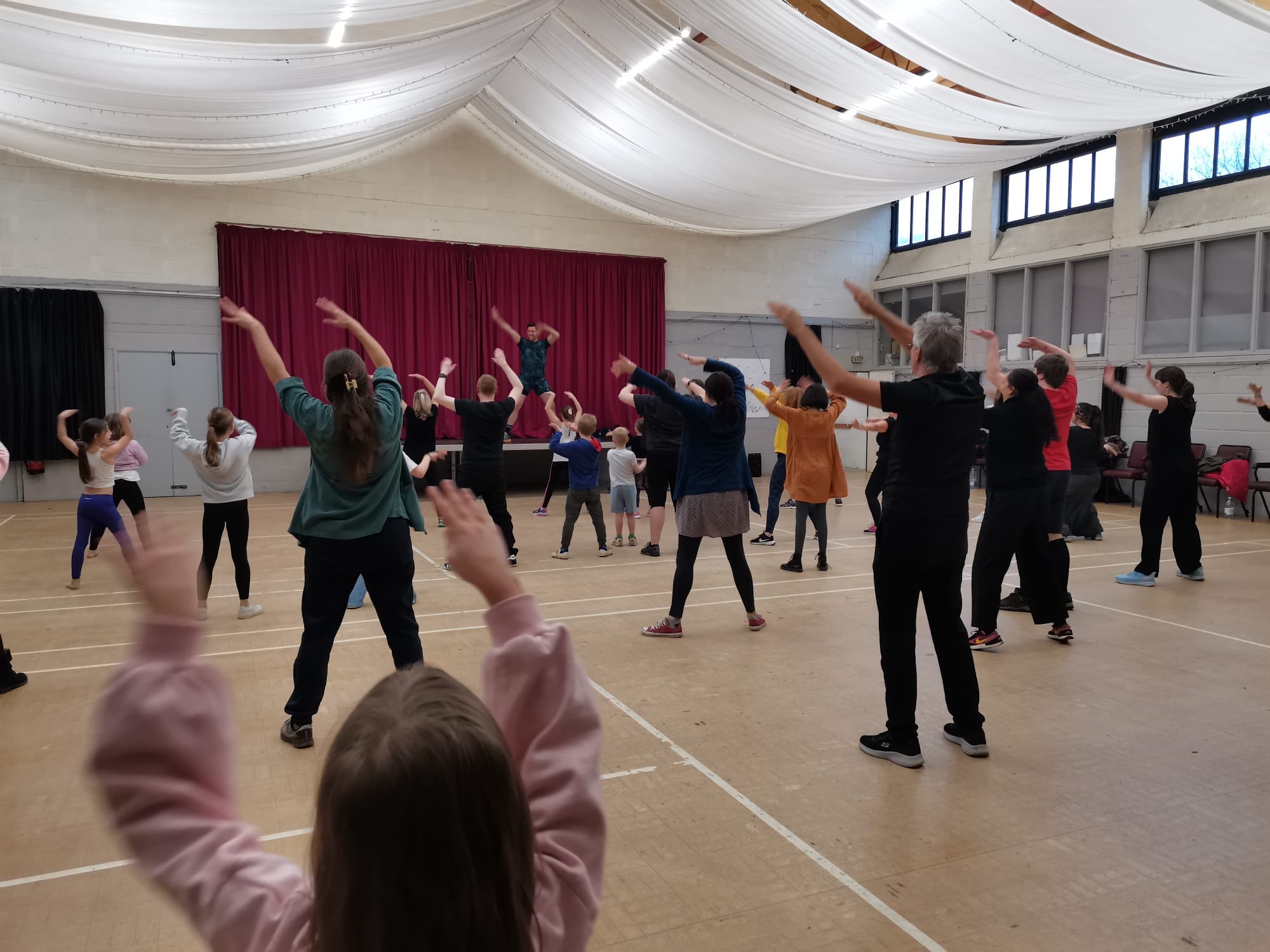 Busy community Zumba class following Jason from the stage